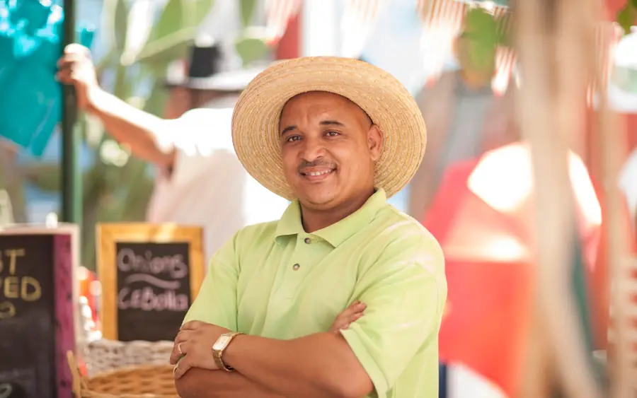 A market trader in a straw hat